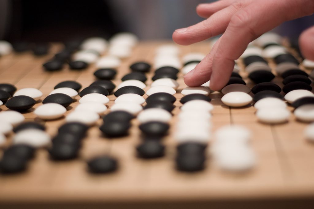 Person playing Go board game