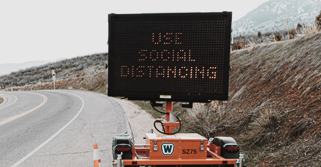 Sign telling people to social distance